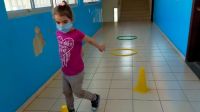 Christina, during her psychomotor therapy session, overcoming obstacles to reach the end of the course. 