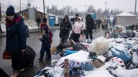 Families fleeing conflict in Ukraine cross the border to Poland